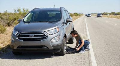 A car hire vehicle pulled over on a Texas highway with its damaged plastic undertray hanging down