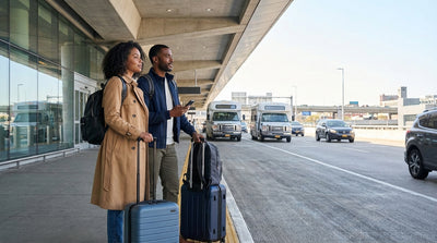 A traveler with luggage waits for the LaGuardia Airport shuttle to the car hire center in New York