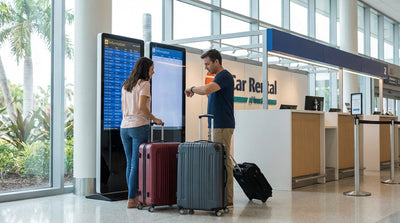 A row of clean cars available for car rental in a sunny Orlando airport parking garage