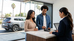 Customer handing a credit card to an agent at a Los Angeles car hire desk