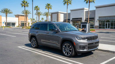 A driver parks their car hire in the busy Las Vegas Premium Outlets parking lot on a sunny day