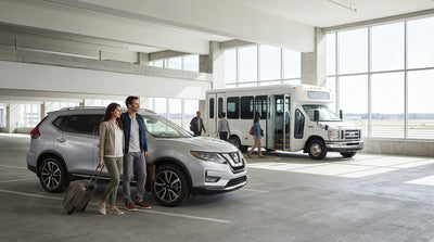 The on-site car hire desks at Philadelphia International Airport with travelers waiting in line in Pennsylvania