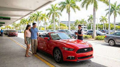 A person's hands holding the keys and contract for their car rental in Miami with the city blurred behind