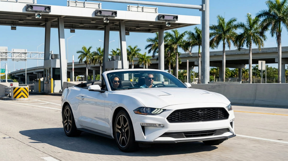A car rental drives through an express lane toll gantry on a sunny highway in Miami with palm trees
