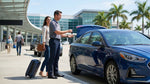 A friendly representative greets a traveler for their car hire pickup at an airport in the United Estates