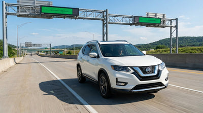 View from a car rental approaching an E-ZPass Only toll gantry on a highway in Pennsylvania