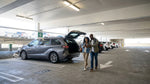 Rows of cars in numbered bays at the SFO car hire center in San Francisco