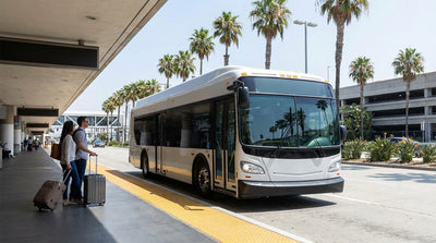 A car hire shuttle bus waits for passengers outside the LAX airport terminal in Los Angeles