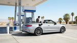 Driver pumping gas into a silver car hire at a Las Vegas gas station