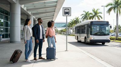 A purple sign for car rental shuttles on the curb outside Tom Bradley Terminal at LAX in Los Angeles