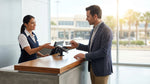 A person pays for their car hire with a business credit card at a rental counter in a Texas airport