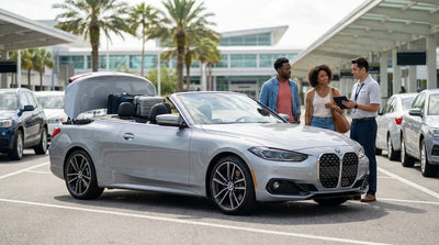 Person opening the door of a white car rental parked on a sunny Orlando street