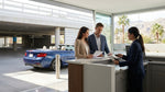 Customer reviewing documents at a car hire desk in Las Vegas