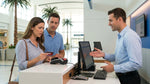 Close up of a person holding a credit card at an Orlando car hire counter