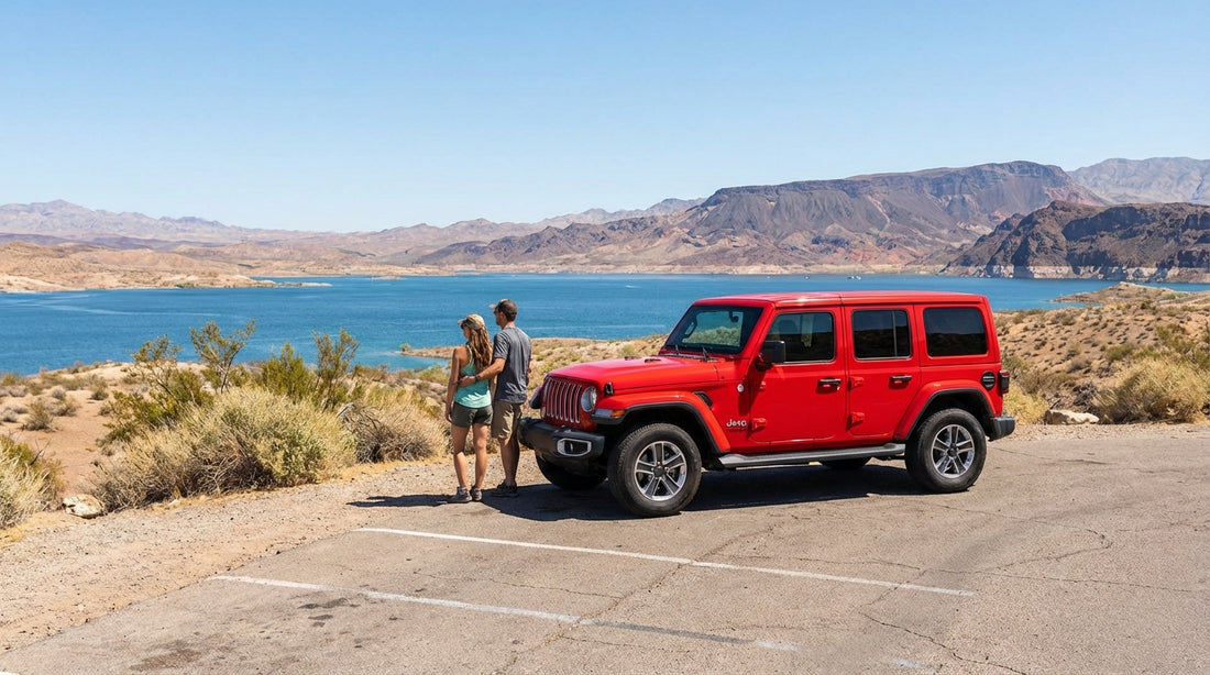 A red convertible car hire driving on a scenic road overlooking Lake Mead near Las Vegas
