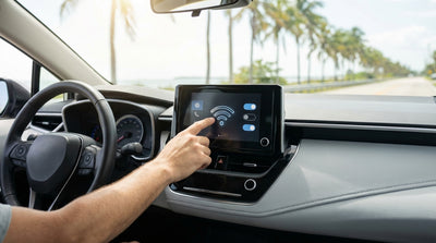 View from inside a car hire in Florida, showing the dashboard and a sunny road with palm trees