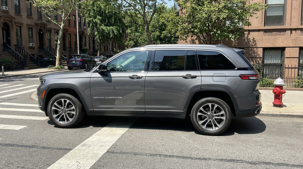 A car hire parked near a red fire hydrant on a busy street in New York City