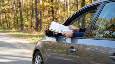 Driver's view from a car hire on a highway in Pennsylvania with green hills in the distance