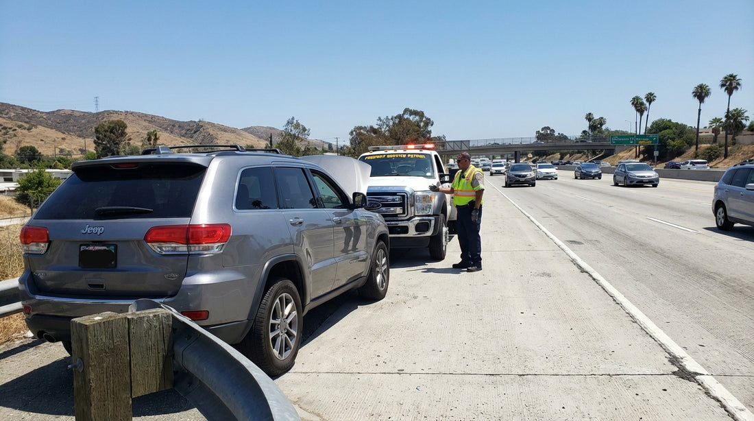 A car hire vehicle with its hazard lights on, pulled over on the shoulder of a busy Los Angeles freeway