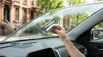 A car rental approaches an E-ZPass toll booth on a busy New York highway
