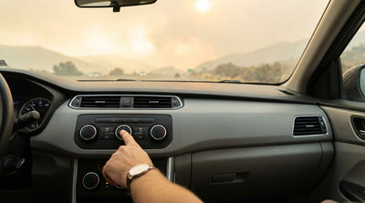 A car hire drives on a California highway with hazy orange smoke from a wildfire filling the air