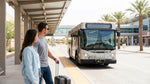 The white shuttle bus for the Las Vegas car rental center waiting for passengers at the airport terminal