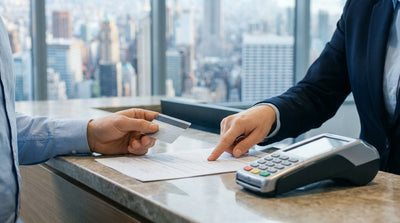 A silver car rental parked on a street in the Dumbo neighborhood of New York, with the Manhattan Bridge visible