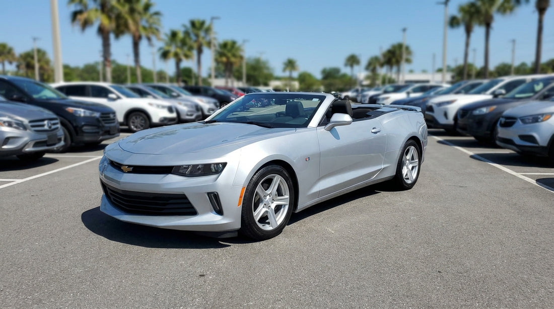 A silver SUV car hire on a scenic desert road trip through the United States