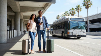 Travelers wait for the LAX-it shuttle bus to the car rental center outside the Los Angeles airport