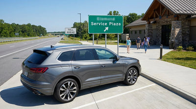 A view from a car hire driving along a scenic highway in upstate New York during a vibrant sunset