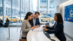 Close up of hands reviewing a car rental agreement on a desk with a New York street visible in the background