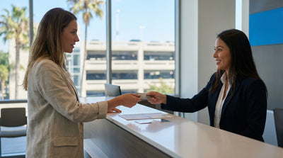 View from a convertible car hire driving along a sunny, palm-lined street in Los Angeles