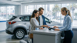 Hands passing a credit card across a car rental counter in San Francisco