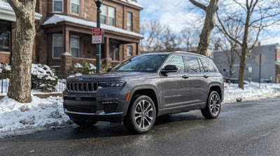 A car rental parked on a snow-covered residential street during a winter storm in Philadelphia, Pennsylvania