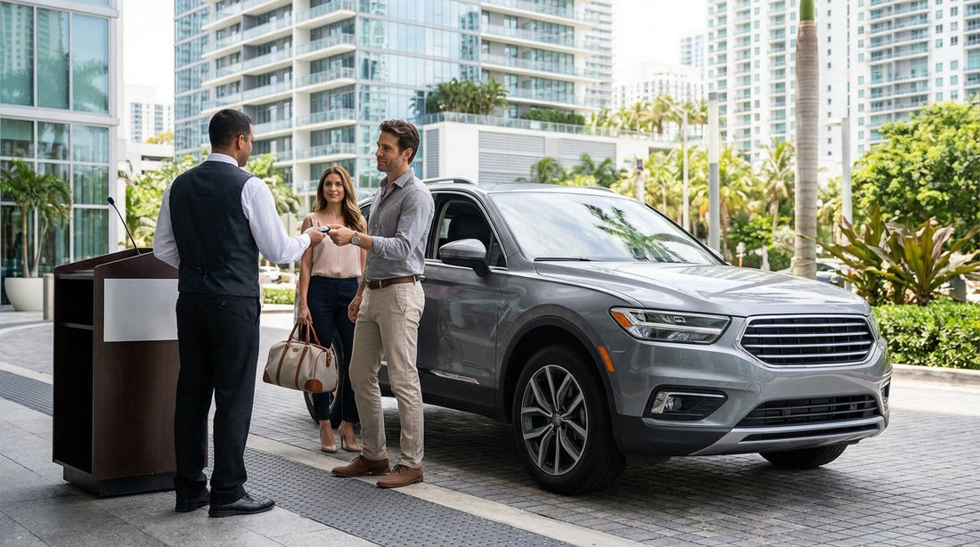 Valet attendant parking a modern car hire in front of a luxury hotel on a sunny street in Brickell, Miami