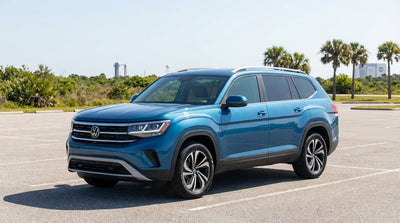 A modern car hire driving down a sunny, palm-lined highway on a day trip from Orlando