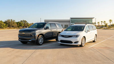 A white SUV car hire driving down a long, empty highway through the Texas landscape at sunrise