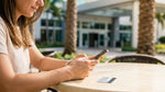 Customer handing a credit card to an agent at a Florida car hire counter