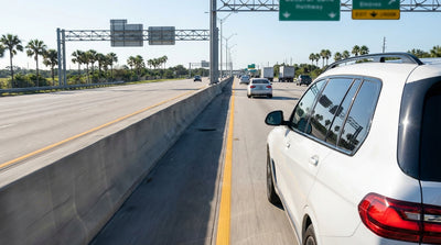 View from a car hire on the I-4 highway in Orlando showing the overhead signs for the express toll lanes