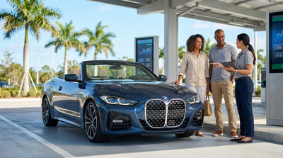 A red convertible car rental driving down a scenic coastal highway with palm trees in sunny Florida