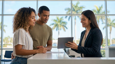 A red convertible car rental driving down a palm-lined coastal road in sunny Florida