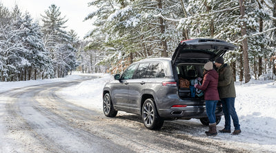 A car hire drives down a scenic, snow-covered road in the mountains of Pennsylvania
