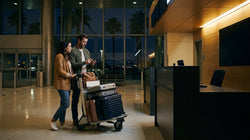 Empty car rental counter with closed signs inside a Los Angeles airport terminal