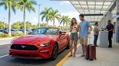A modern car hire parked on a sun-drenched street in Miami with tall palm trees overhead