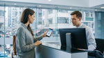 Person holding a smartphone displaying a digital driving licence at a car rental desk in New York