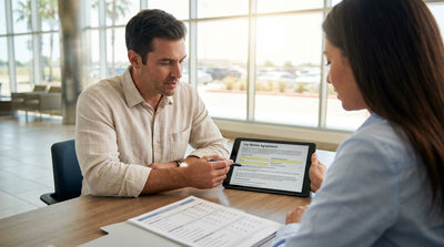 A modern sedan from a car rental service parked on a scenic road overlooking the Texas landscape