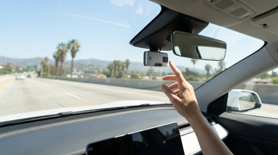 A car hire drives on a sunny freeway towards the downtown Los Angeles skyline
