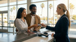 Close-up of a hand passing a credit card to a clerk at a California car rental counter