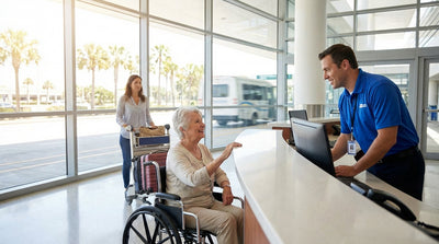 An airport employee assists a person in a wheelchair with their car rental at a sunny Miami location