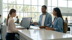 Close-up of a customer handing a credit card to an agent at a car rental desk in Orlando